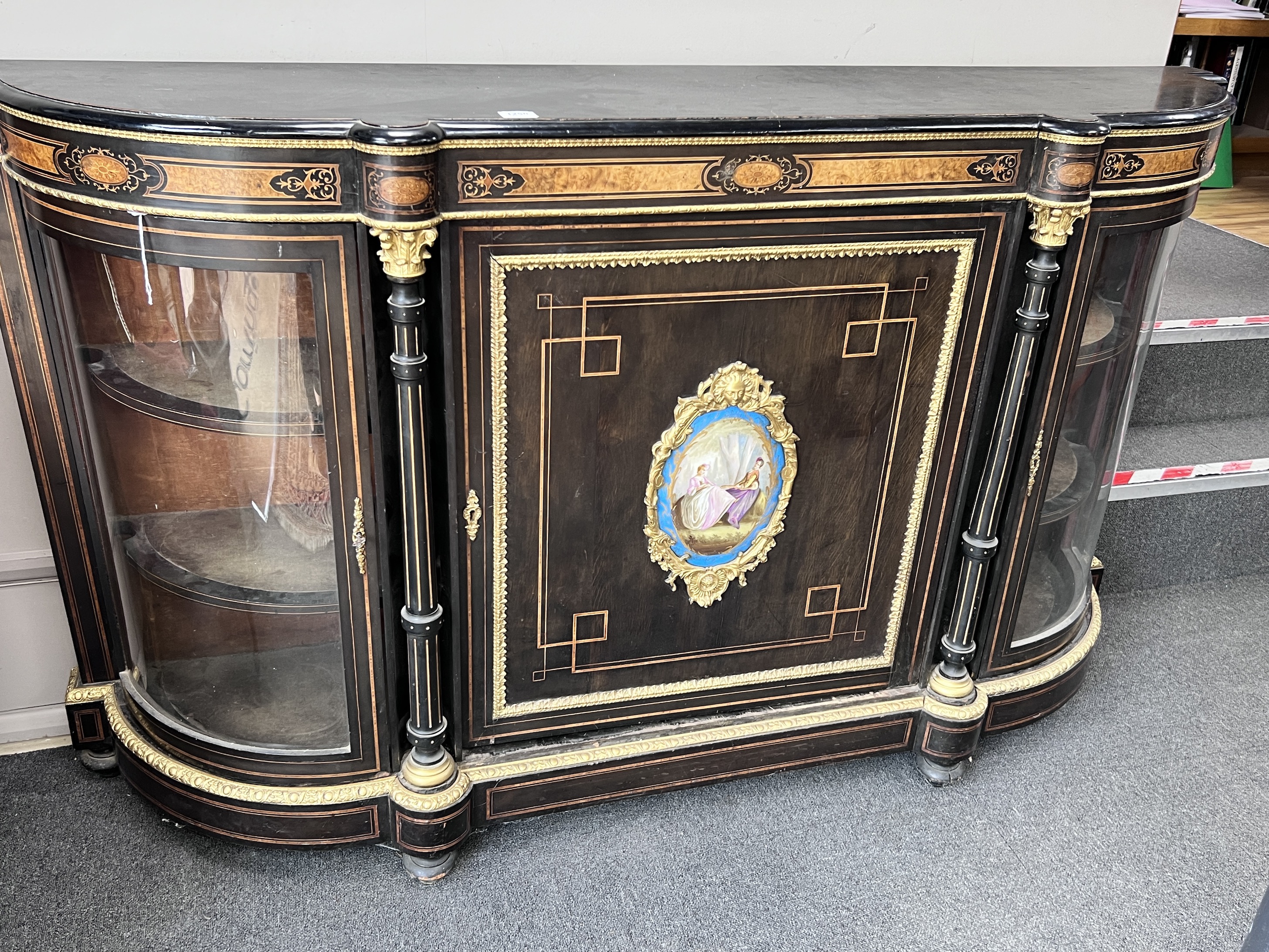 A large ebonised Victorian walnut and ebonised credenza central Sevres style porcelain plaque, width 183cm, height 108cm